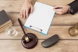 Lawyer Filling Document Scaled